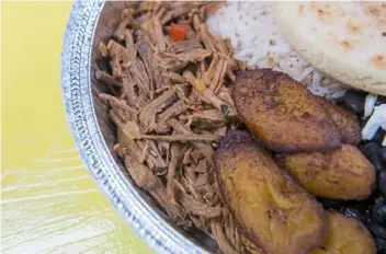  ?? Emily Matthews/Post-Gazette ?? Arepittas serves Venezuela’s national dish, pabellon criollo.