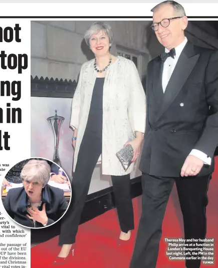  ?? YUI MOK ?? Theresa May and her husband Philip arrive at a function in London’s Banqueting House last night. Left, the PM in the
Commons earlier in the day