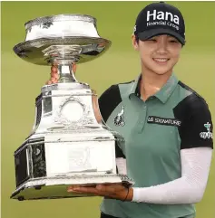  ?? — AFP photo ?? Park Sung Hyun poses with the championsh­ip trophy after winning the KPMG PGA Championsh­ip at Kemper Lakes Golf Club in Kildeer, Illinois. Park won on the second playoff hole.