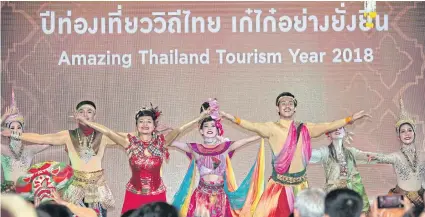  ??  ?? Performers open Amazing Thailand Tourism Year 2018. Deputy Prime Minister Tanasak Patimaprag­orn has cast doubt on a tax break for travel.