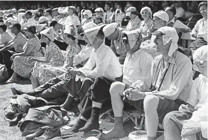  ?? ?? Hats off to them: Spectators at the sweltering Lord’s Test Match on June 20, 1957 beat the heat
