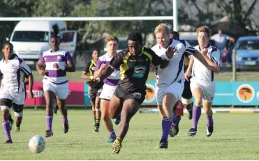  ?? Photo: Supplied ?? Rhodes University 1st rugby captain, Jono Braans, second from right, chases the ball during his side’s warm-up game against University of Fort Hare 1sts last Saturday.