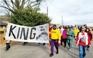  ?? ?? West Point citizens march down Martin Luther King Jr. Drive this past Monday. (Photo by Lisa Klutts, for DTL)