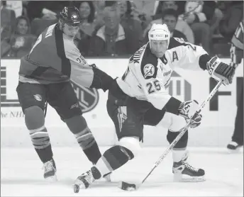  ?? CP PHOTO ?? Tampa Bay Lightning’s Dave Andreychuk and San Jose Sharks’ Matt Bradley follow the puck during the first period March 1, 2002, at the Ice Palace in Tampa, Fla. Andreychuk had a sense that his numbers would be good enough to get him into the Hockey Hall...