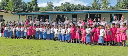  ?? Photo: ?? Georgia rugby side with students of Draiba Primary School, Suva, on June 11, 2018.
