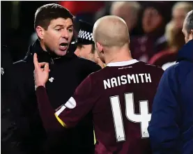  ??  ?? Rangers manager Steven Gerrard argues with Steven Naismith