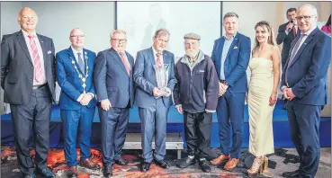  ?? Arthur) (Pic: Brian ?? JP McManus (centre) accepted the Limerick Persons of the Year Award 2022 on behalf of the JP McManus Pro-Am Organising Committee. On his left is 86 year old Busker and Hall of Fame entrant, Tom McNamara. Also pictured l-r: Pat Hartigan, Mayor of the City and County of Limerick; Cllr Francis Foley, Director of Southern; David O’Hora, committee member; Andrew Bermingham, managing editor of Limerick Leader; Áine Fitzgerald, deputy chief executive Limerick City and County Council and Sean Coughlan.