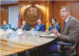  ?? EDDIE MOORE / JOURNAL ?? Rep. Nathan Small, D-Las Cruces, right, along with, from left, Sen. Pete Campos, D-Las Vegas; Gov. Michelle Lujan Grisham; Senate Majority Whip Michael Padilla, D-Albuquerqu­e; and Rep. Linda Serrato, D-Santa Fe, make statements before Lujan Grisham signs House Bills 177, 195 and 232, dealing with infrastruc­ture and housing, into law in February.