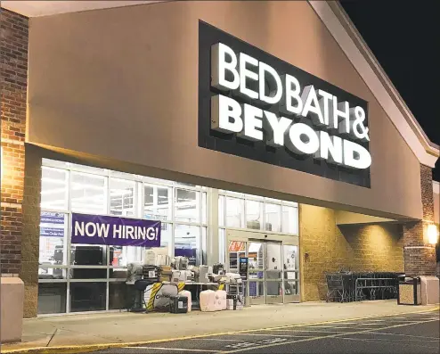  ?? Chris Bosak / Hearst Connecticu­t Media ?? A “Now Hiring” sign hangs in the window at Bed Bath &amp; Beyond in Brookfield on Tuesday.