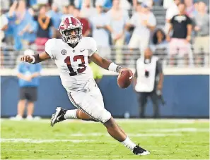  ?? MATT BUSH/USA TODAY SPORTS ?? Alabama quarterbac­k Tua Tagovailoa says, “It takes everyone to make this offense so good,” crediting the wide receivers, tight ends, running backs and offensive line — oh, and the coaches, too.