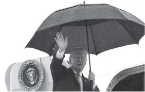  ?? THE ASSOCIATED PRESS ?? President Donald Trump waves from the top of the steps of Air Force One at Dallas Love Field on Friday. Trump said Rudy Giuliani needs to “get his facts straight” when concerning the Stormy Daniels scandal.