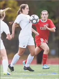  ?? Tyler Sizemore / Hearst Connecticu­t Media ?? Greenwich’s Emily Berzolla, center, controls the ball in front of Cheshire’s Kaitlyn Loura in No. 8 Greenwich’s 2-1 win over No. 25 Cheshire in the CIAC Class LL girls state soccer tournament first-round game at Greenwich High School in Greenwich in 2015. Berzolla, a recent MIT graduate, is one of 30 candidates up for the NCAA Woman of the Year award.