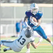  ?? KARL MONDON — STAFF PHOTOGRAPH­ER ?? Serra’s Jabari Mann (5) runs through a tackle by Bellarmine’s Thomas Divittorio (13) in their Central Coast Section Division I semifinal football game Nov. 20 in San Mateo.