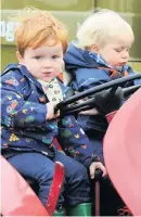  ??  ?? Wheely good time Archie Hunter, 2, from East Kilbride and one-year-old Innes Arnott from Hamilton