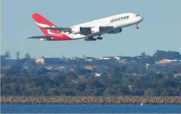  ?? (Jason Reed/Reuters) ?? A QANTAS A380 aircraft takes off from Sydney Internatio­nal Airport en route to Dubai, above Botany Bay, in August.