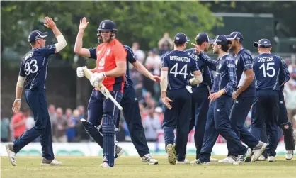  ??  ?? David Willey makes his way back to the pavilion while Scotland celebrate on their way to a memorable ODI victory over England on Sunday. Photograph: Kevin Murray/ProSports/Rex/Shuttersto­ck