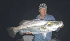  ??  ?? CRACKER: Justin Gibbins (All Tackle Sport Fishing) with a healthy metre-plus barra he measured and released in last weekend's Tinaroo Barra Bonanza.