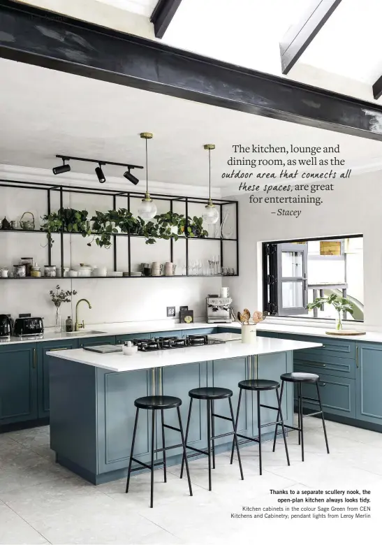  ??  ?? Thanks to a separate scullery nook, the open-plan kitchen always looks tidy. Kitchen cabinets in the colour Sage Green from CEN Kitchens and Cabinetry; pendant lights from Leroy Merlin