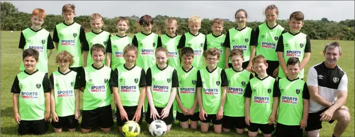  ??  ?? Pictured at the FAI soccer summer camp at All Blacks AFC grounds were boys and girls from the under-13 age group, with their coach James Quinn.