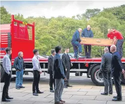  ?? Pictures: Paul Reid. ?? Mike Willox’s coffin was transporte­d from Arbroath to the crematoriu­m in Friockheim on the back of his own Brown and Tawse lorry, freshly painted for the occassion – in accordance with a promise made by his family.