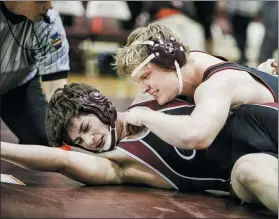  ?? NATE HECKENBERG­ER - FOR MEDIANEWS GROUP ?? Conestoga’s Liam Kirk nears a pin against Lower Merion’s Quinn Black at 195pounds.