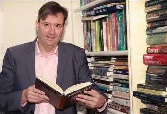  ??  ?? Michael D’Arcy at home: he enjoys a good read.