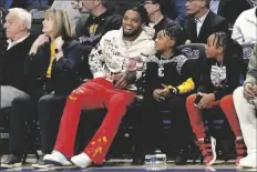  ?? MATT FREED/AP ?? BUFFALO BILLS SAFETY DAMAR HAMLIN watches as Pittsburgh takes on Georgia Tech during the first half of a NCCA college basketball game in Pittsburgh on Feb. 21.