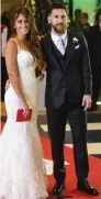  ?? AFP ?? Lionel Messi with bride Antonella Roccuzzo in Rosario, Argentina