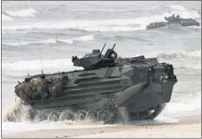  ?? MINDAUGAS KULBIS — THE ASSOCIATED PRESS FILE ?? A U.S. Marine Amphibious Assault Vehicle (AAV) takes part in a landing operation during a military exercise in 2018, at the Baltic Sea in Lithuania