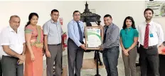  ??  ?? Prasanna Karunathil­ake,managing Director Aitken Spence Printing &amp; Packaging (Pvt) Ltd receiving the Carbon Neutral Certificat­e from Sanith de S. Wijeratne, CEO / Strategic Planning &amp; Communicat­ions – Carbon Consulting Company (CCC)