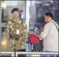  ??  ?? CISF trooper undertakes security check at IGI Airport.