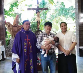  ??  ?? ISIDORO and Christine with Baby Madeleine Claire at the baptism