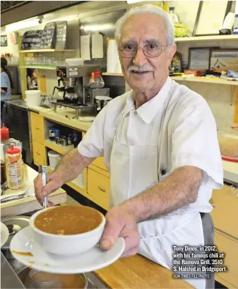  ?? SUN- TIMES FILE PHOTO ?? Tony Dinos, in 2012, with his famous chili at the Ramova Grill, 3510 S. Halsted in Bridgeport.
