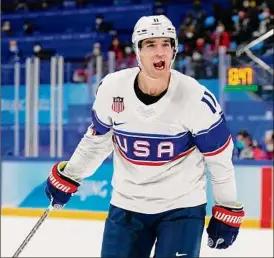  ?? Matt Slocum / Associated Press ?? Team USA’s Kenny Agostino celebrates after scoring a goal against Canada on Saturday. The Americans won 4-2 to stay perfect so far.