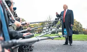  ?? JABIN BOTSFORD THE WASHINGTON POST ?? U.S. President Donald Trump talks to members of the media at the White House on Nov. 2. Trump wasted little time on Wednesday morning threatenin­g the newly elected Democratic House.