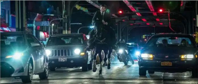  ?? LIONSGATE ?? John Wick (Keanu Reeves) is back in action in “John Wick: Chapter 3 — Parabellum.”