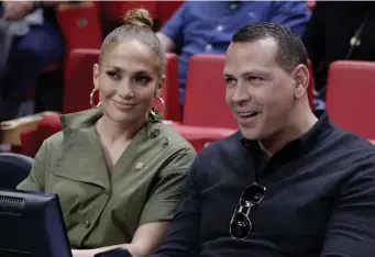  ?? AP FILE ?? NO DEAL: Jennifer Lopez (left) and Alex Rodriguez sit courtside of a game between the Los Angeles Lakers and Miami Heat in Miami on Dec. 13, 2019.