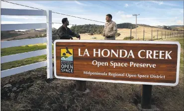  ?? PHOTOS BY PATRICK TEHAN — STAFF PHOTOGRAPH­ER ?? On Tuesday, Steve Neighbors, left, and Don Mackessy, of the MidPeninsu­la Regional Open Space District, put some finishing touches on the entrance at the new La Honda Creek Open Space Preserve in San Mateo County.