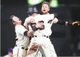  ?? Scott Strazzante / The Chronicle ?? Christian Arroyo (left) and Gorkys Hernandez (in helmet) greet Hunter Pence after Hernandez scored on Pence’s sacrifice fly.