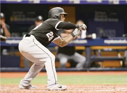  ?? JULIO AGUILAR/GETTY IMAGES ?? Leury Garcia drops down a two-strike bunt that led to a critical error by Rays third baseman Matt Duffy.