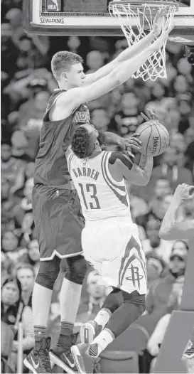  ?? Karen Warren / Houston Chronicle ?? Rockets guard James Harden, right, tries to drive to the basket against the Knicks’ Kristaps Porzingis, who rejected seven shots in New York’s victory.