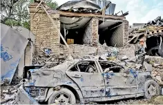  ??  ?? A damaged car is seen at the blast site hit by a rocket during the fighting over the breakaway region of Nagorno-Karabakh, in the city of Ganja, Azerbaijan. Reuters