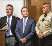  ?? DAILY NEWS ?? Rene Boucher (center) appears in court for an arraignmen­t hearing with his attorney, Matt Baker (left), on Thursday at the Warren County Justice Center in Bowling Green, Ky. Boucher pleaded not guilty.