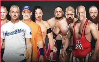  ??  ?? Team Raw (r) vs Team Smackdown