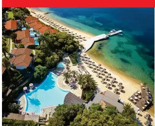  ?? ?? TIMELESS ELEGANCE: direct beach access at Eagles Palace, left; beach dining at the resort’s Armyra restaurant, right; Junior Suite, below