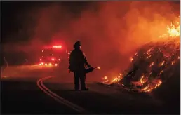  ?? JOSH EDELSON/AFP/GETTY IMAGES ?? A firefighte­r lights a back fire during the Kincade Fire on Thursday near Geyservill­e.