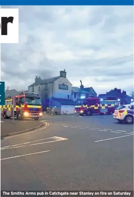  ??  ?? The Smiths Arms pub in Catchgate near Stanley on fire on Saturday