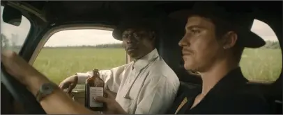  ?? The Associated Press ?? SIGN OF THE TIMES: Jason Mitchell, left, and Garrett Hedlund in a scene from "Mudbound."