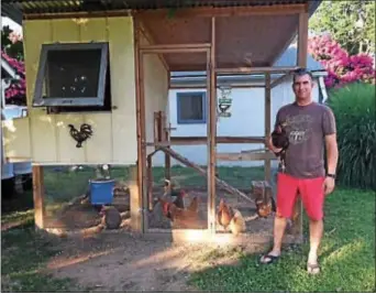  ?? DIGITAL FIRST MEDIA FILE PHOTO ?? Brandon Bates stands next to the chicken coop in the back yard of his Haverford home.