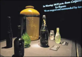  ??  ?? Various bottles, intact despite decades at the bottom of the North Atlantic, are part of the exhibit at Luxor.